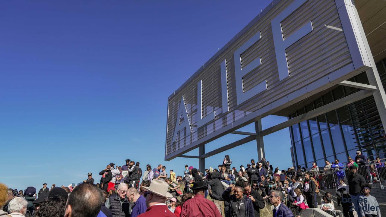 Small business owner in Alief reviewing ad campaign results on a mobile device.