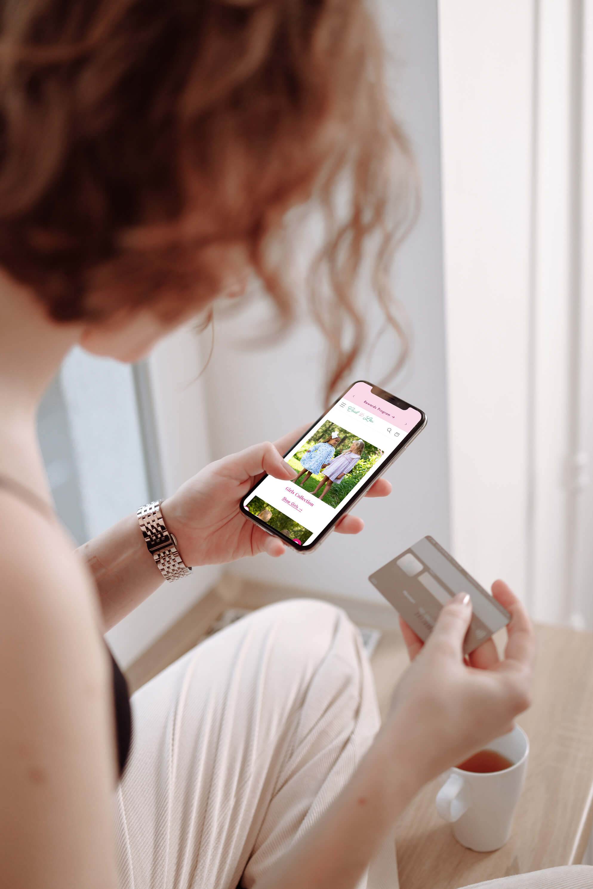 The Cecil & Lou Shopify storefront open on a phone, showing the girls' collection and a shop link