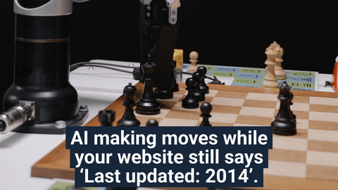 Robot arm playing chess on a wooden board, with black and white pieces mid game, overlaid with the caption “AI making moves while your website still says Last updated 2014,” hinting that AI is advancing while old sites stay frozen in time.